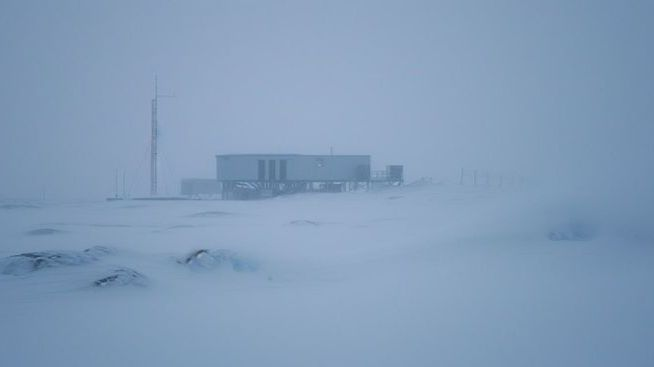 An isolated research outpost almost erased by snow and fog.